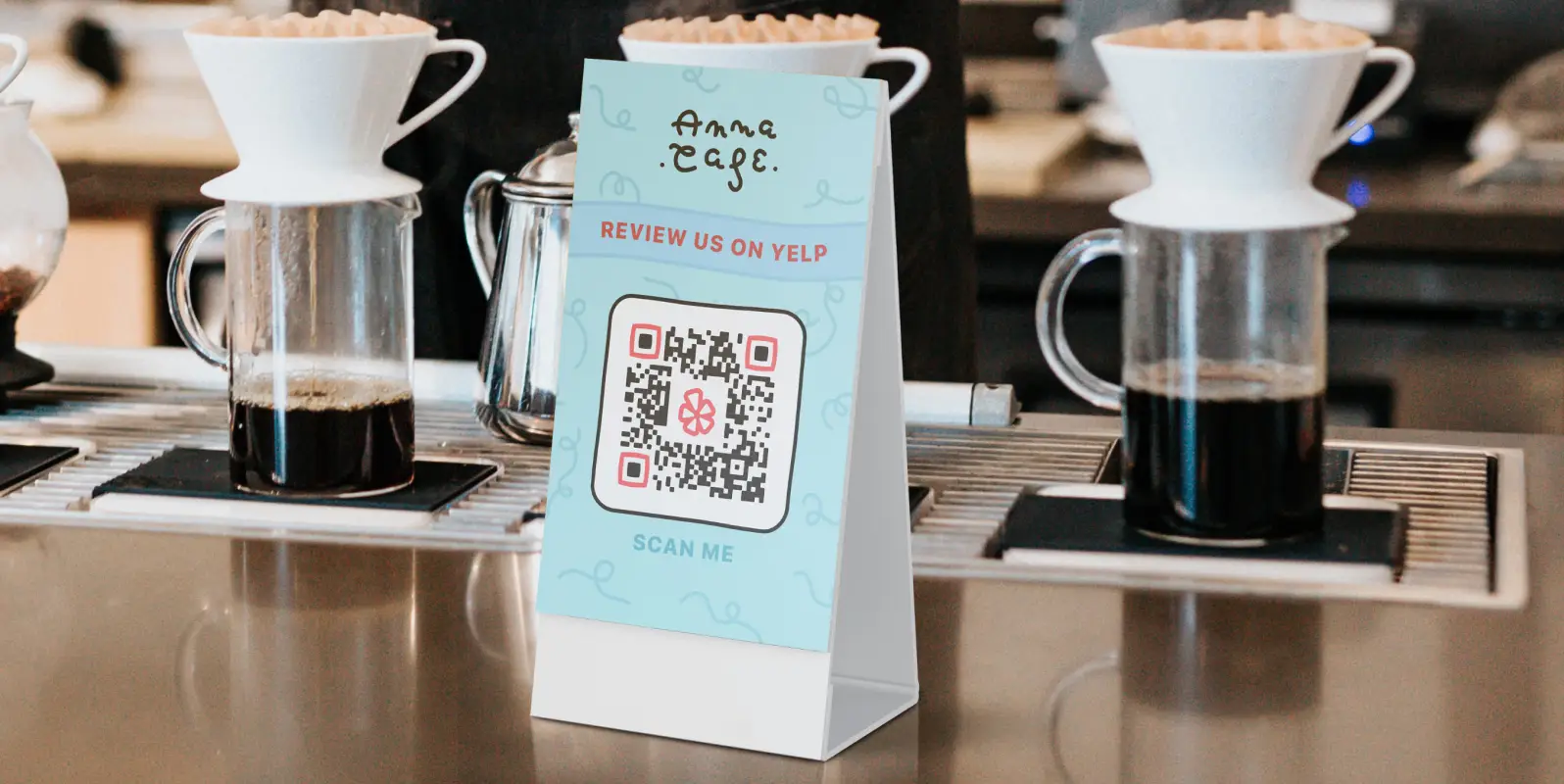 Cafe tabletop display card with a qr code on it.