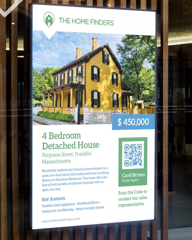 An advertisement for a detached house in the window of a real estate company. It features a QR Code to get into contact with the sales representative.