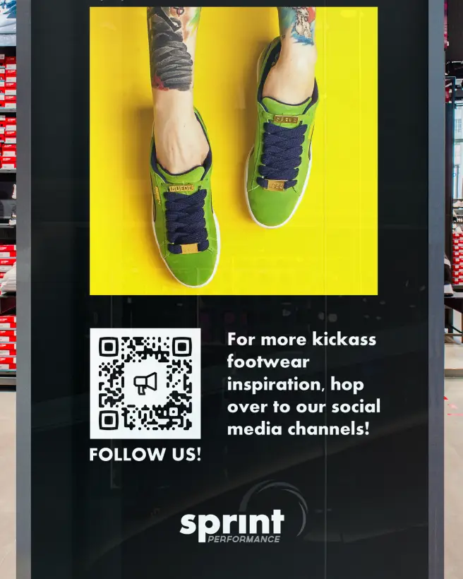 A shoe retailer's endcap ad promoting social media follows for more inspiration via QR Code.