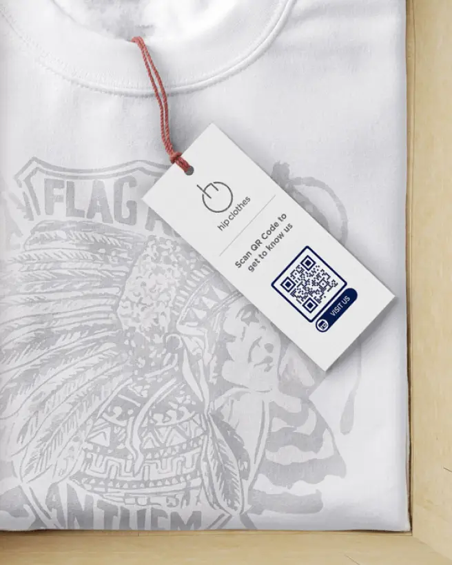 White tshirt with a hang tag displaying a QR Code.