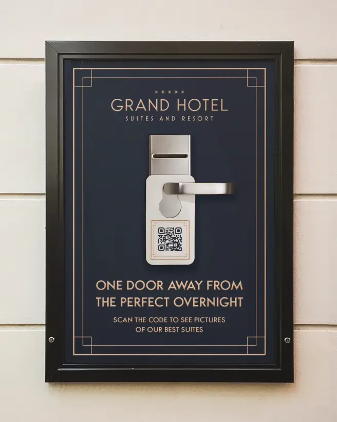 Hotel's poster advertisement with a door handle and QR Code hangtag on it.