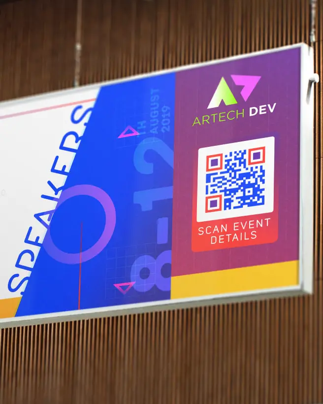 A large banner at a conference that features a QR Code with more event details.