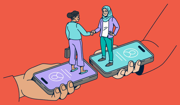 Two people standing on smartphones shaking hands.