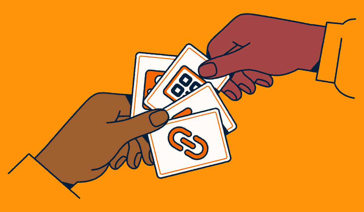 Person selecting a game card with a QR Code on it.