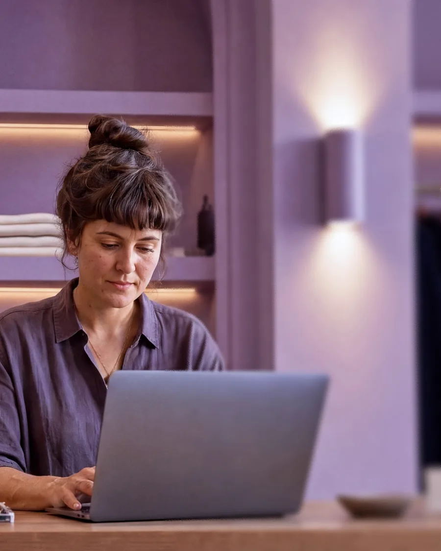 Retail owner working on a laptop